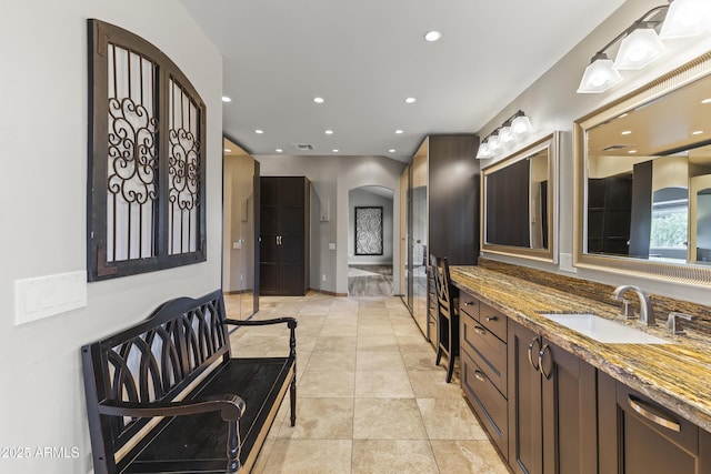 bathroom with vanity and tile patterned flooring