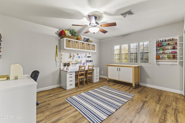 office with ceiling fan and wood-type flooring