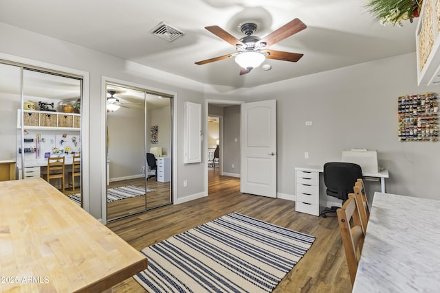 bedroom featuring ceiling fan and dark hardwood / wood-style floors