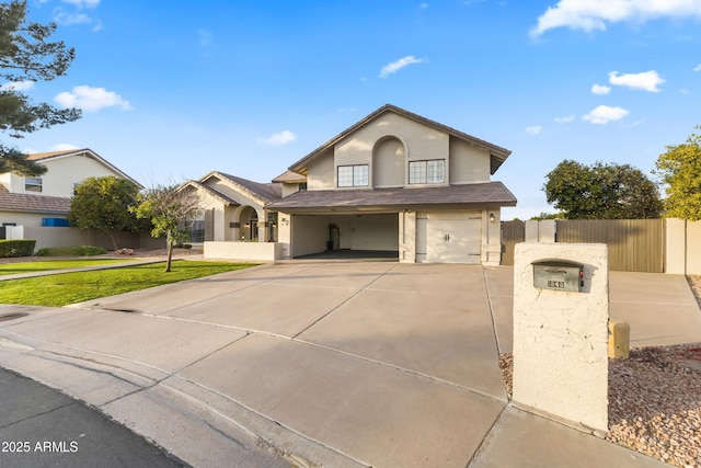 view of front of property featuring a garage and a front yard