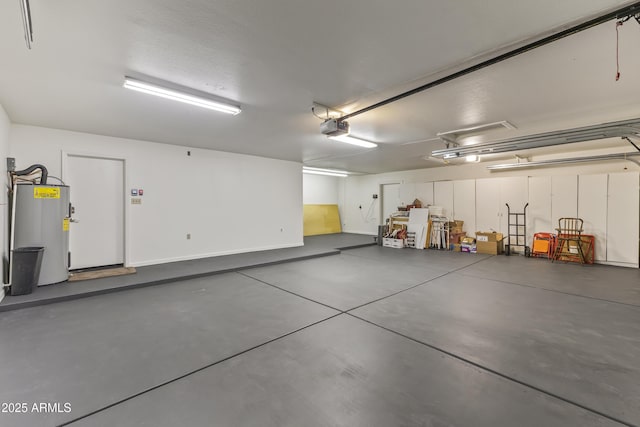 garage featuring a garage door opener and water heater