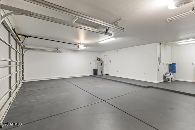 garage featuring water heater and a garage door opener