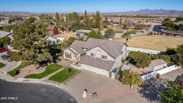 birds eye view of property featuring a mountain view