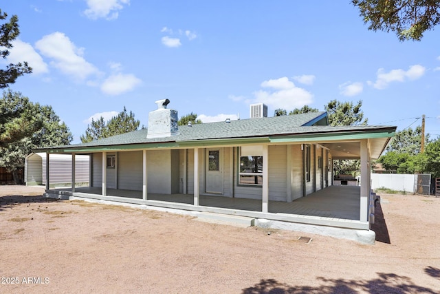 8168 W Camino Real, Payson, AZ 85541 - view of front of home featuring a chimney, covered porch, and central air condition unit