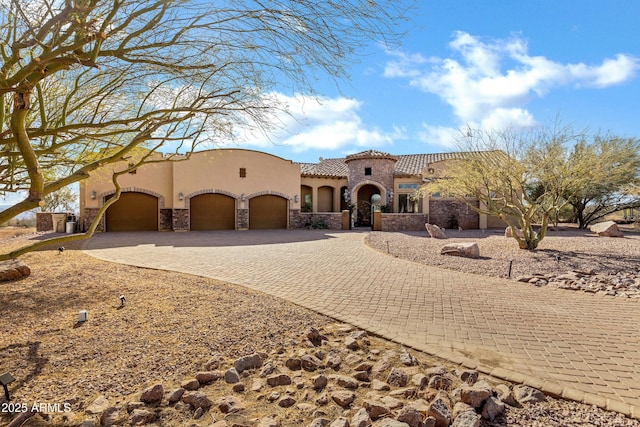 mediterranean / spanish-style home featuring a garage