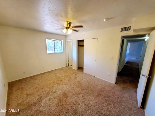 unfurnished bedroom with carpet flooring and ceiling fan