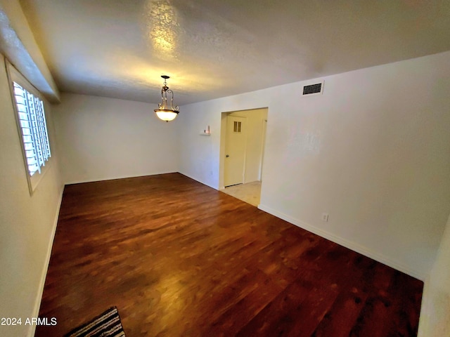 spare room with hardwood / wood-style floors