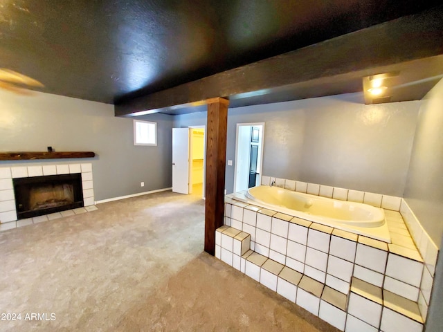 unfurnished living room with carpet floors and a tiled fireplace