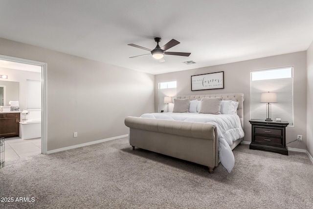 bedroom with light colored carpet, visible vents, connected bathroom, ceiling fan, and baseboards