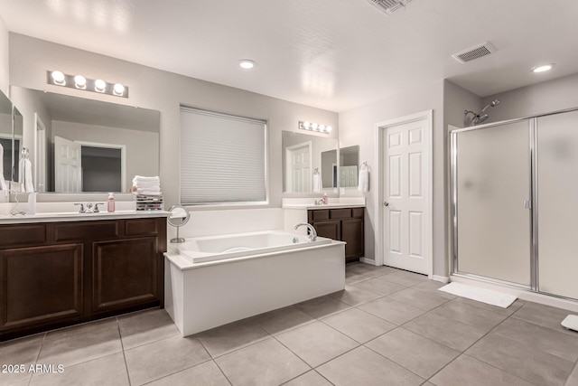 bathroom with visible vents, a stall shower, vanity, tile patterned flooring, and a bath