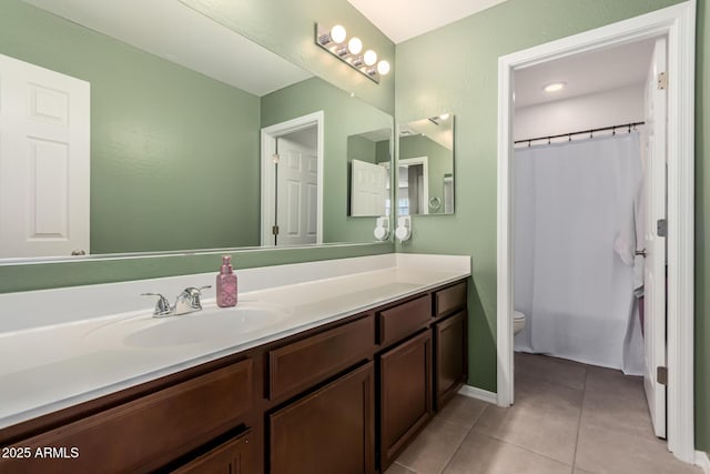 full bath featuring toilet, tile patterned flooring, and vanity