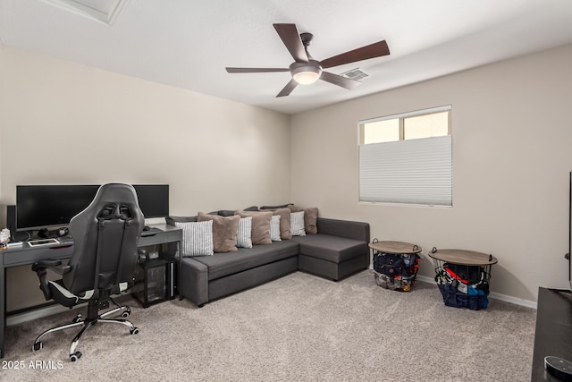 carpeted office featuring visible vents, ceiling fan, and baseboards