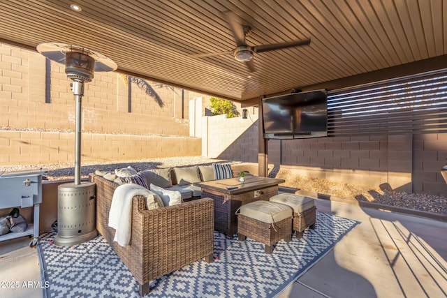 view of patio / terrace with a ceiling fan, a fenced backyard, and an outdoor hangout area