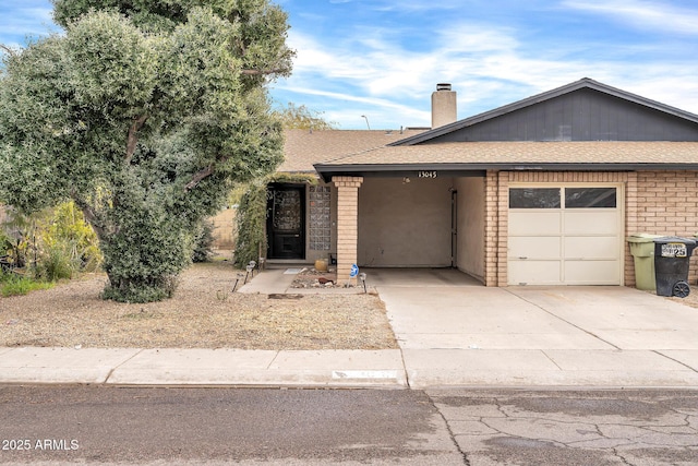 single story home with a garage