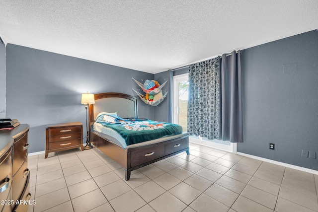 tiled bedroom with a textured ceiling