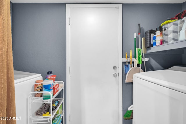 washroom featuring washer and clothes dryer