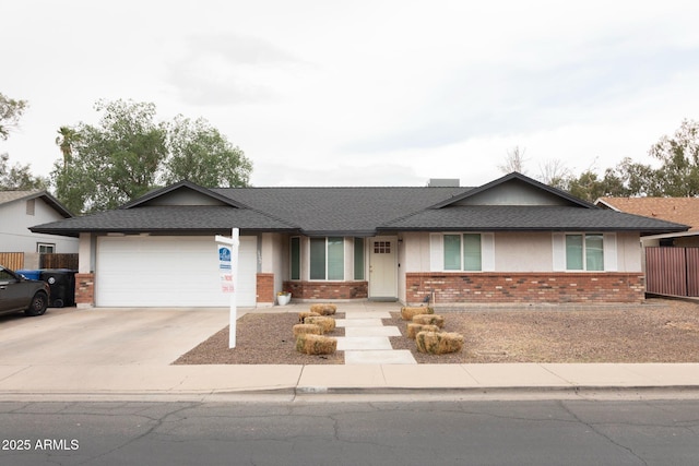 ranch-style house featuring brick siding, a garage, and concrete driveway