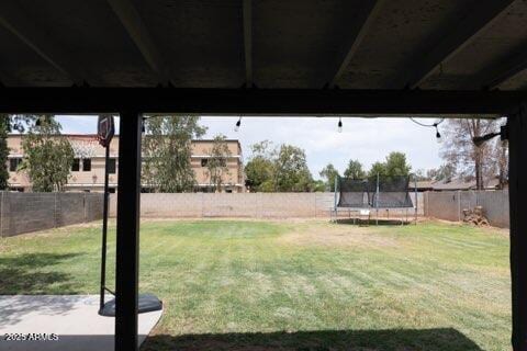 view of yard with a trampoline