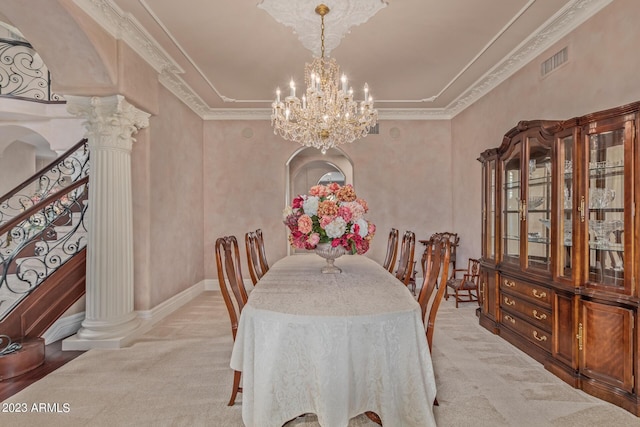 dining area with decorative columns, visible vents, carpet flooring, a chandelier, and stairs