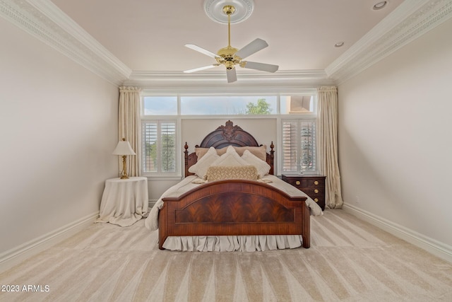 bedroom with light carpet, ornamental molding, a ceiling fan, and baseboards