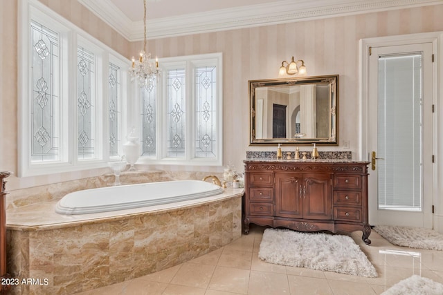 bathroom with ornamental molding, vanity, a chandelier, tile patterned flooring, and a bath