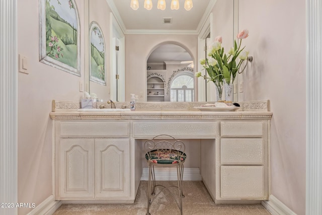 bathroom featuring baseboards, vanity, visible vents, and ornamental molding