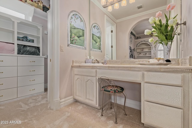 bathroom with ornamental molding, visible vents, vanity, and baseboards