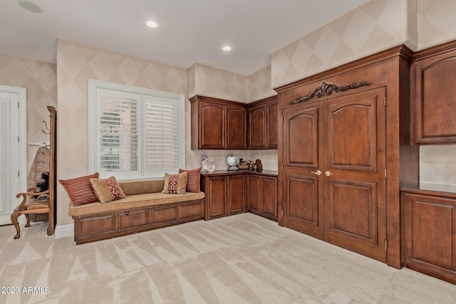 kitchen featuring recessed lighting, light carpet, and wallpapered walls