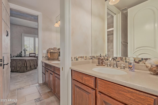 full bath featuring visible vents, vanity, and ensuite bathroom