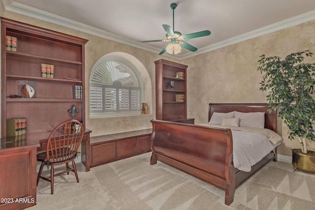 carpeted bedroom featuring built in study area, crown molding, and ceiling fan