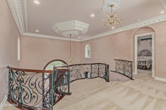 staircase with carpet floors, a chandelier, and crown molding