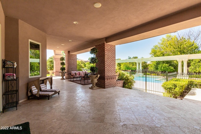 view of patio / terrace featuring fence, an outdoor living space, and a fenced in pool