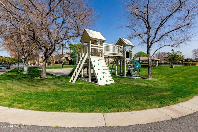 community jungle gym with a yard