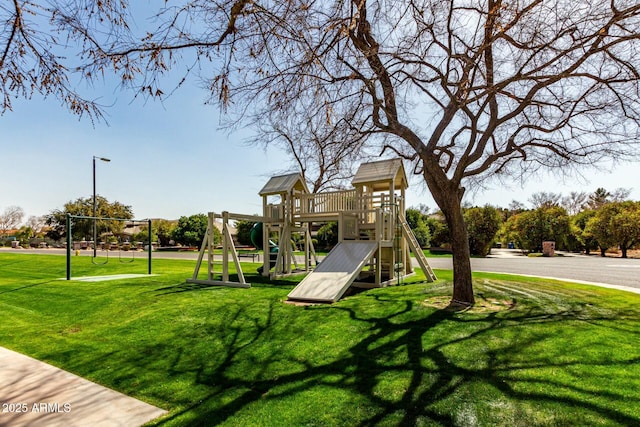 community play area featuring a lawn