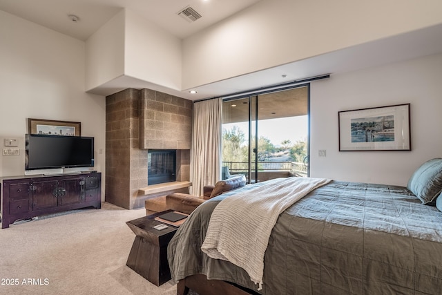 9216 E Sky Line Dr, Scottsdale, AZ 85262 - bedroom featuring access to exterior, carpet, a glass covered fireplace, and recessed lighting