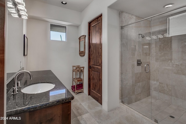 bathroom with vanity and walk in shower