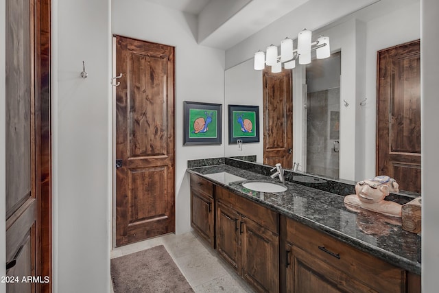 bathroom featuring vanity and a shower with shower door