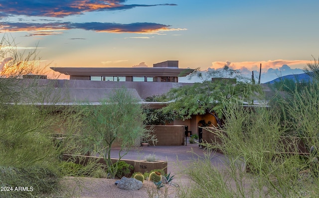 exterior space featuring a mountain view and a patio area