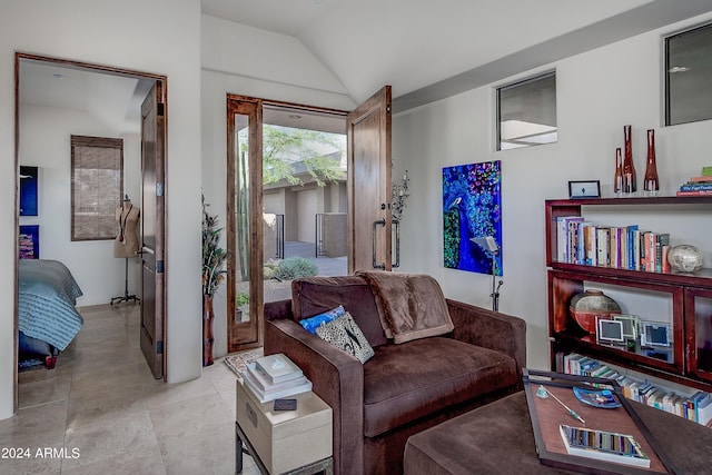 living room featuring lofted ceiling