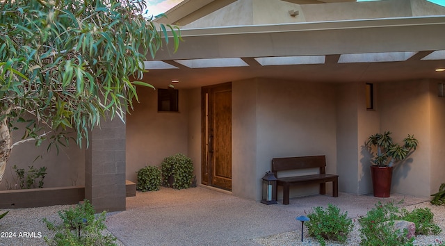 entrance to property featuring a patio area