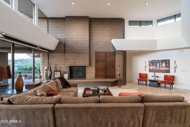 9216 E Sky Line Dr, Scottsdale, AZ 85262 - living room with recessed lighting, a towering ceiling, and a brick fireplace
