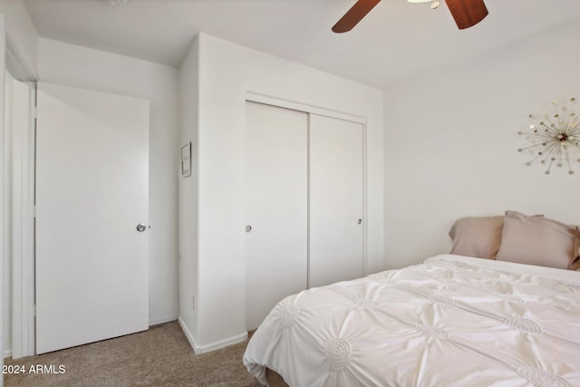 bedroom featuring a closet, ceiling fan, and carpet floors