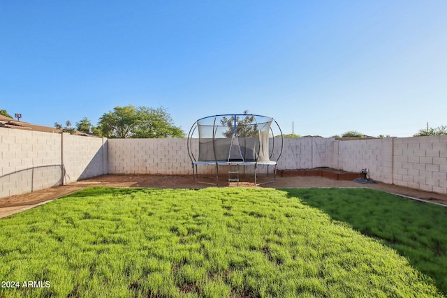 view of yard featuring a trampoline