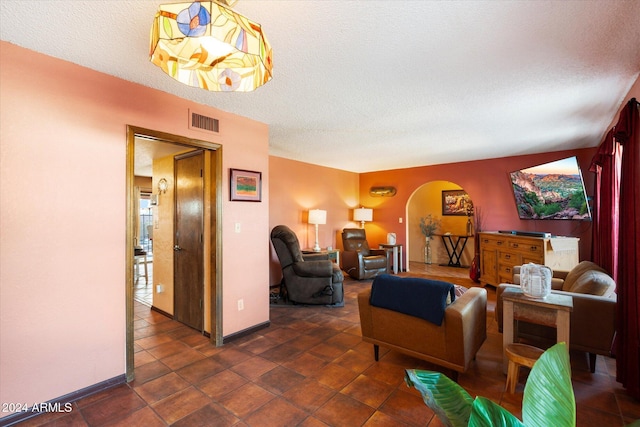 living room with a textured ceiling