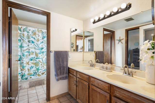 bathroom with tile patterned floors, vanity, and a shower with curtain