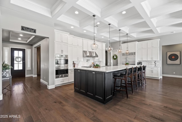 5415 E Chaparosa Way, Cave Creek, AZ 85331 - kitchen with stainless steel appliances, under cabinet range hood, light countertops, white cabinets, and coffered ceiling