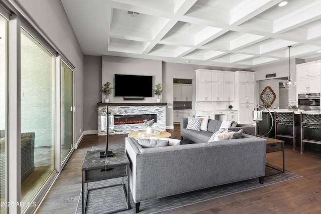5415 E Chaparosa Way, Cave Creek, AZ 85331 - living area with coffered ceiling, a glass covered fireplace, beamed ceiling, dark wood finished floors, and baseboards