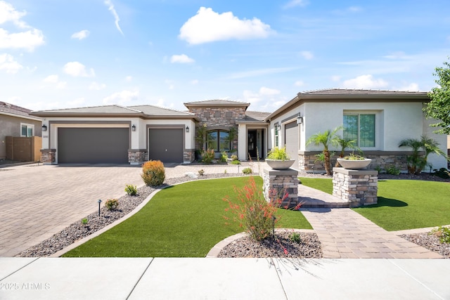 5415 E Chaparosa Way, Cave Creek, AZ 85331 - prairie-style house featuring stone siding, a garage, decorative driveway, and stucco siding