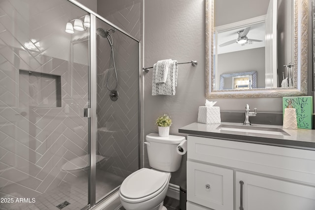 5415 E Chaparosa Way, Cave Creek, AZ 85331 - full bath with vanity, toilet, a shower stall, a textured wall, and a ceiling fan