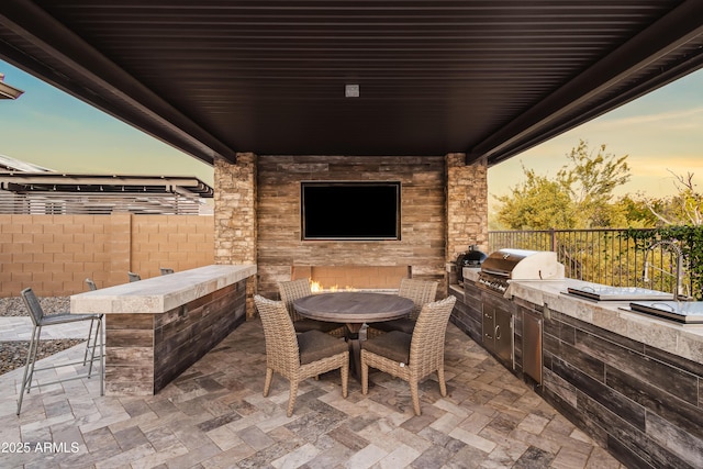 5415 E Chaparosa Way, Cave Creek, AZ 85331 - view of patio featuring an outdoor stone fireplace and outdoor dining space